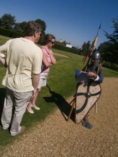 ENGLAND, East Sussex, Battle, "Battle Abbey. Visitors in grounds of partially ruined abbey complex,