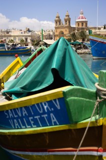 MALTA, Marsaxlokk , Fishing village harbour on the south coast with colourful Kajjiki fishing boats