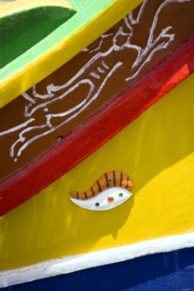 MALTA, Marsaxlokk , Fishing village harbour on the south coast with colourful Kajjiki fishing boat