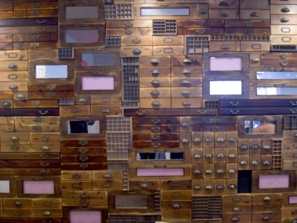 ENGLAND, Hampshire, Portsmouth, Gunwharf Quays. Shop window display of wooden draws filling the