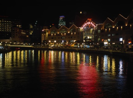SINGAPORE, Clarke Quay, Lights from quayside shops and restaurants reflected in the Singapore River