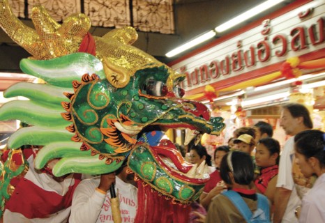 THAILAND, North, Chiang Mai, "Chinese New Year celebrations. Chinese dragon dancers inside Warorot