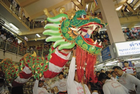THAILAND, North, Chiang Mai, "Chinese New Year celebrations. Chinese dragon dancers inside Warorot