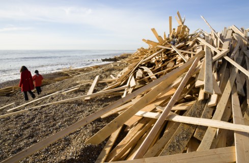 ENGLAND, West Sussex, Worthing, Timber washed up on the beach from the Greek registered Ice