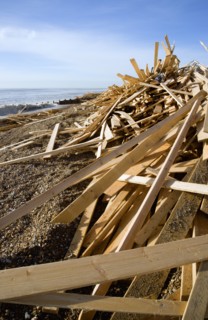 ENGLAND, West Sussex, Worthing, Timber washed up on the beach from the Greek registered Ice