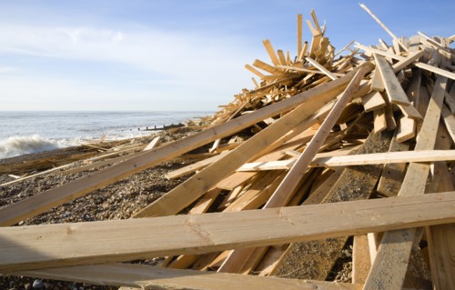ENGLAND, West Sussex, Worthing, Timber washed up on the beach from the Greek registered Ice