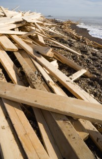 ENGLAND, West Sussex, Worthing, Timber washed up on the beach from the Greek registered Ice
