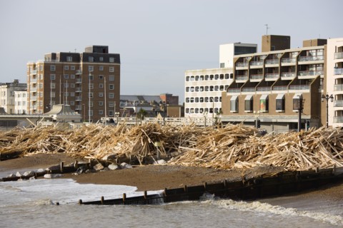 ENGLAND, West Sussex, Worthing, Timber washed up on the beach from the Greek registered Ice