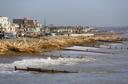 ENGLAND, West Sussex, Worthing, Timber washed up on the beach from the Greek registered Ice