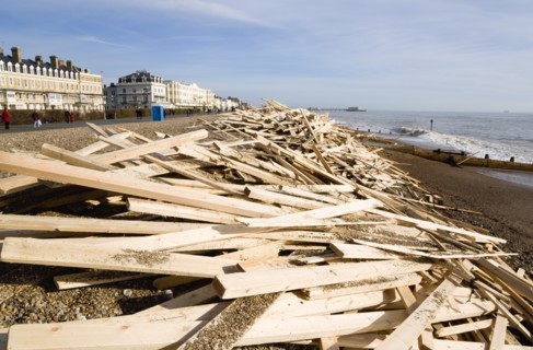 ENGLAND, West Sussex, Worthing, Timber washed up on the beach from the Greek registered Ice