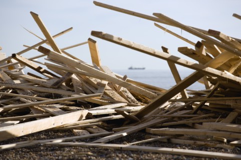 ENGLAND, West Sussex, Worthing, Timber washed up on the beach from the Greek registered Ice