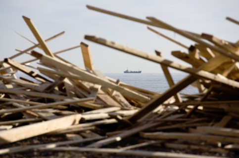 ENGLAND, West Sussex, Worthing, Timber washed up on the beach from the Greek registered Ice