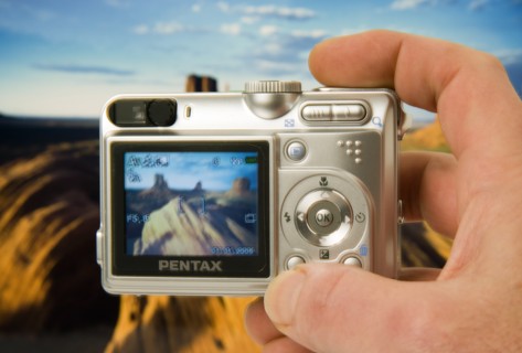 TECHNOLOGY, Media, Photography, Digital camera held in a hand with an image on the screen and in