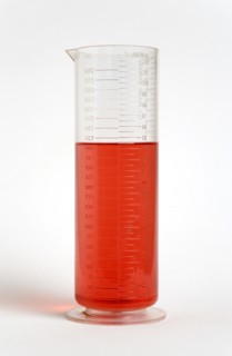 SCIENCE, Medical, Measurement, Plastic measuring beaker containing light red liquid and showing