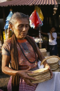 MEXICO, Food and Drink, Woman selling tortillas at market.