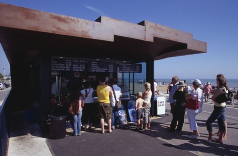 ENGLAND, West Sussex, Littlehampton, "People queuing at the East Beach Cafe, a seafront structure