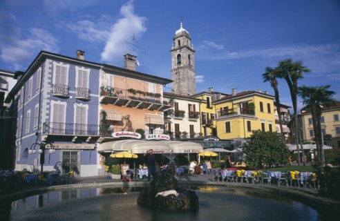 ITALY, Piedmont, Lake Maggiore, Pallanza.  Bar and cafe with people sitting at outside tables in