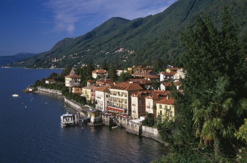 ITALY, Piedmont, Lake Maggiore, Cannero Riviera.  Waterside buildings with red tiled rooftops at