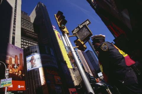 USA, New York, New York City, Times Square.  Angled view of traffic police officer standing below