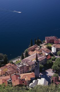 ITALY, Lombardy, Lake Como, "Varenna.  Looking down on red tiled rooftops, church and bell tower of