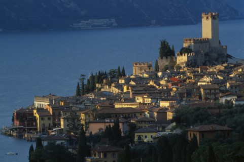 ITALY, Veneto, Lake Garda, "Malcesine.  View across town rooftops towards Castello Scaligero in