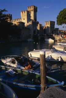 ITALY, Lombardy, Lake Garda , Sirmione.  Rocca Scaligera medieval castle with crowds of visitors