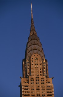 USA, New York, New York City, Part view of the Chrysler Building from East 42nd Street lit by