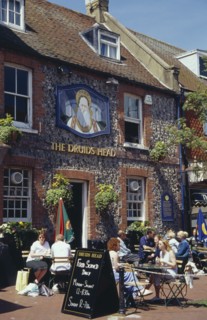 ENGLAND, East Sussex, Brighton, The Druids Head Pub exterior with people sat outside at tables