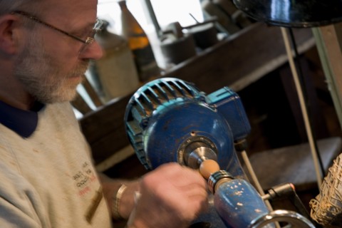 ENGLAND, West Sussex, Amberley, Amberley Working Museum. The West Sussex Woodturners with a man