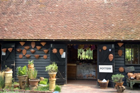 ENGLAND, West Sussex, Amberley, Amberley Working Museum. Pottery building with examples of clay