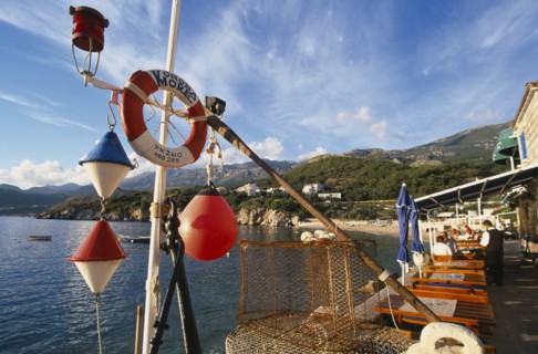 MONTENEGRO, Przno, Waterfront restaurants with fishing nets and nautical decoration looking out