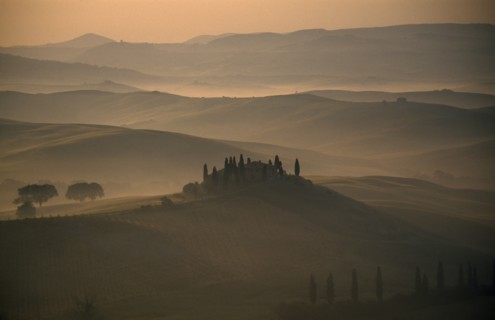 ITALY, Tuscany, San Quirico, View over The Belvedere in early morning mist