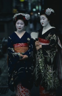 JAPAN, Customs, Geisha, Two maiko or apprentice geisha with white powdered faces and red painted