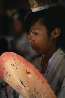 JAPAN, Kyushu, Kaseda Shrine, "Portrait of young shrine maiden employed to welcome visitors,