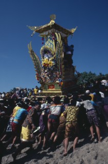 INDONESIA, Bali, Kuta, "Crowd carrying body of deceased to burning ground in highly decorated
