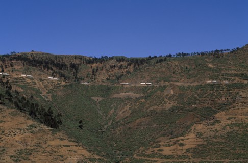 ERITREA, Aid, Distant view towards UN relief convoy of World Food Programme trucks on high Asmara -