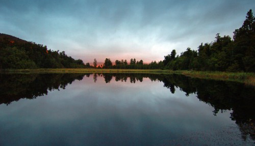 NEW ZEALAND, SOUTH ISLAND, WEST COAST, "LAKE MATHESON, DUSK LOOKING EAST ACROSS LAKE MATHESON