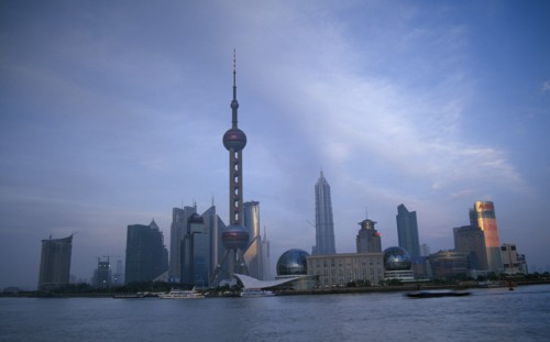 CHINA, Shanghai, Pudong skyline at dusk with skyscrapers including the Oriental Pearl Tower and the
