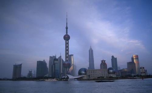 CHINA, Shanghai, Pudong skyline at dusk with skyscrapers including the Oriental Pearl Tower and the