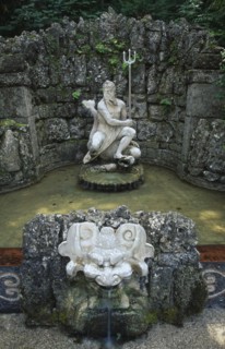 AUSTRIA, Salzburg, Fountain with statue of Neptune in Hellbrunn Palace Gardens known for the