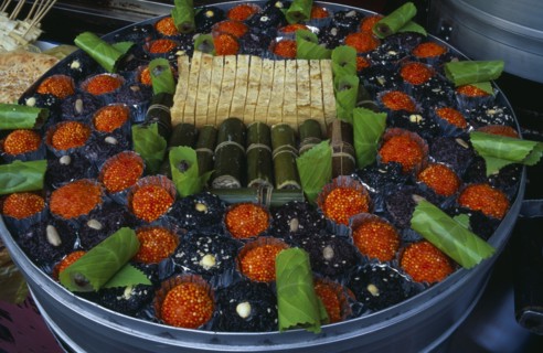 CHINA, Beijing, Donghua Yeshi food market.  Dish of sweetmeats.