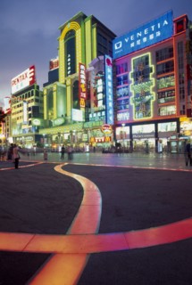 CHINA, Shanghai, Nanjing Lu.  Busy street scene at night with illuminated neon signs and