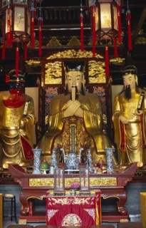 CHINA, Shanghai, "Yu Gardens, Temple of the City of God.  Three golden statues behind small altar