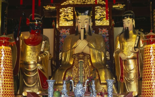 CHINA, Shanghai, "Yu Gardens, Temple of the City of God.  Three golden statues behind small altar.