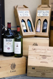 ITALY, Tuscany, Montalcino, Wine shop in the medieval hilltown with a display of wine bottles and