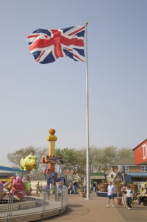 ENGLAND, West Sussex, Littlehampton, Harbour Park Amusements with families enjoying rides.  British