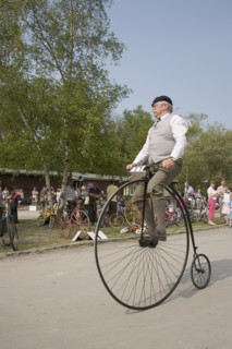 ENGLAND, West Sussex, Amberley, Amberley Working Museum. Veteran Cycle Day Grand Parade. Man