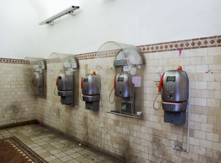 ITALY, Tuscany, Siena, Five public phone boxes in a tiled room