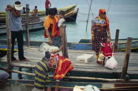 PANAMA, San Blas Islands Tikantiki , Kuna Indians, Kuna Indian women wearing brightly coloured