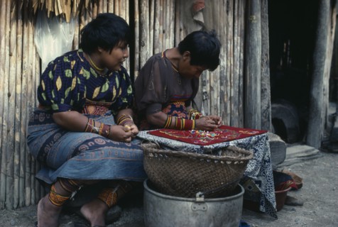 PANAMA, San Blas Islands, Kuna Indians, Kuna Indian women sewing together different layers of cut